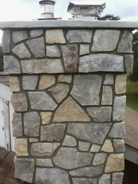 Real Gold & Brown Fieldstone Veneer on a chimney.